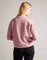 LIVANAA-Tops-Who says you can't be comfortable and chic? With a crew neck, long sleeves and embossed logo detail, LIVANAA is the staple sweatshirt that your wardrobe has been craving. Sweatshirt Embossed Ted Baker logo Crew neck Long sleeves Ayo is 5'8" / 1.73m and wears Red in a Ted size 1- Ted Baker Romania